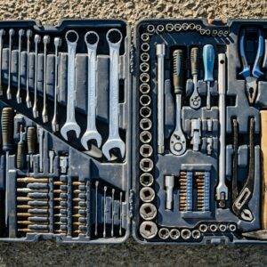 Flat lay of an organized toolbox with a variety of essential hand tools.